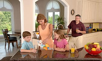 family-drinking-orange-juice-glass-pouring-healthy-home-son-daughter-children-father-thumbnail